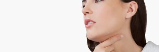 Woman touching her sore throat